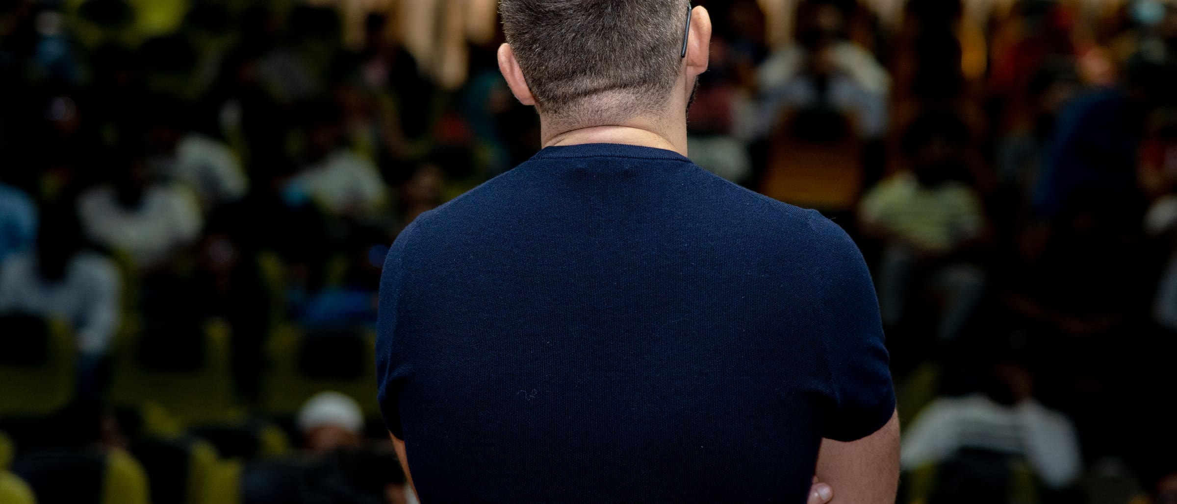 Pre-stage moment in a packed auditorium